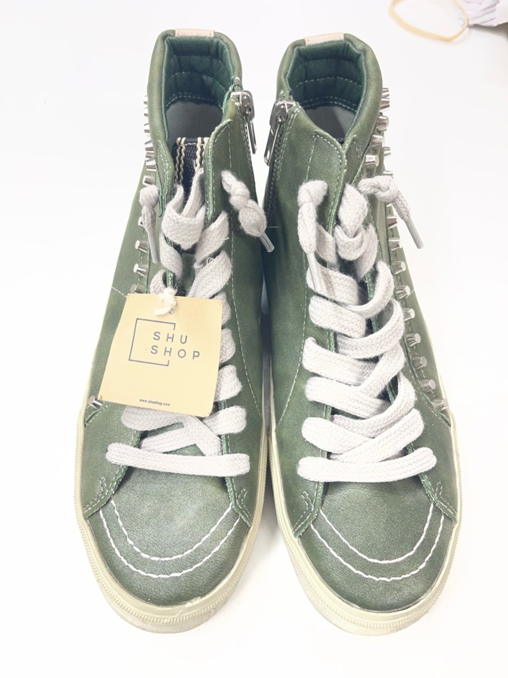 Shu Shop Roxie high-top sneakers in a metallic olive green finish and studding‎